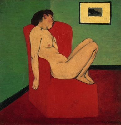 Naked woman sitting in a red armchair
