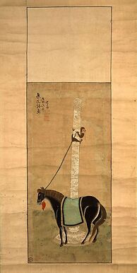 Cheval maintenu au poteau par un singe