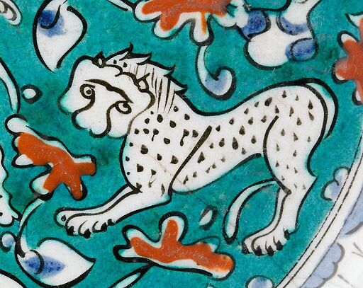 Dish decorated with lion, hares and fantastic animals on a green background II/II
