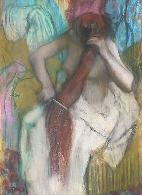 Woman combing her hair