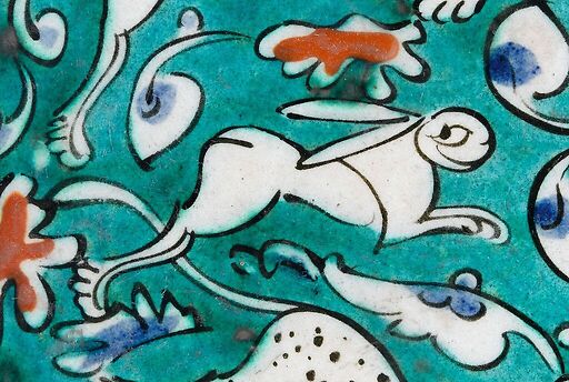 Dish decorated with lion, hares and fantastic animals on a green background I/II