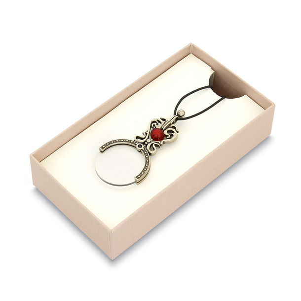 Loupe tour de cou avec perle rouge