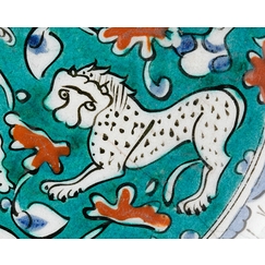Dish decorated with lion, hares and fantastic animals on a green background II/II