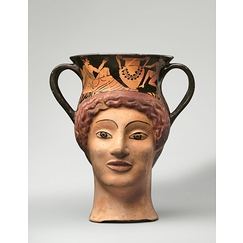 Canthare-vase plastique en forme de tête de femme à figures rouges