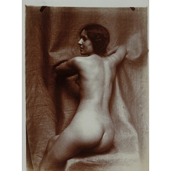 Naked woman sitting three-quarters back, on a chair, face in profile left