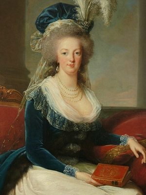 Queen Marie-Antoinette sitting, in a blue coat and white dress, holding a book in her hand